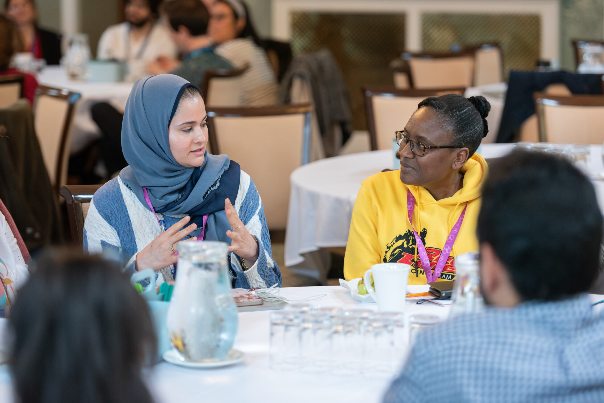 A photo of two researchers having a discussion at a round table session