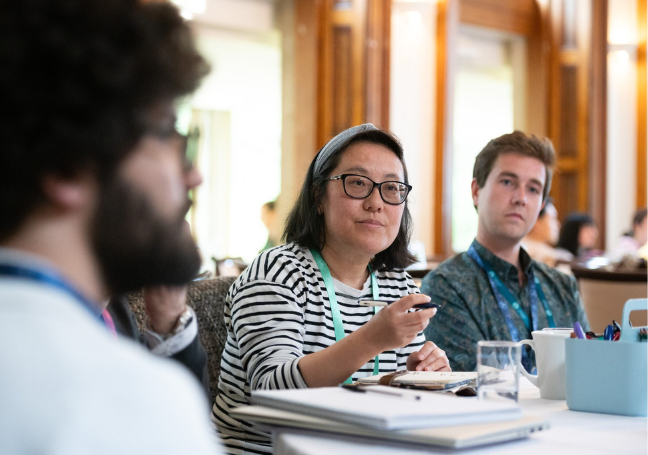 A photo of three people having a round-table discussion